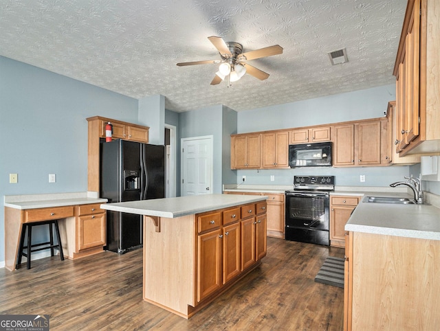 1301 Crosswind Pl, Mcdonough, GA 30252 - kitchen featuring a sink, visible vents, black appliances, and dark wood-style flooring