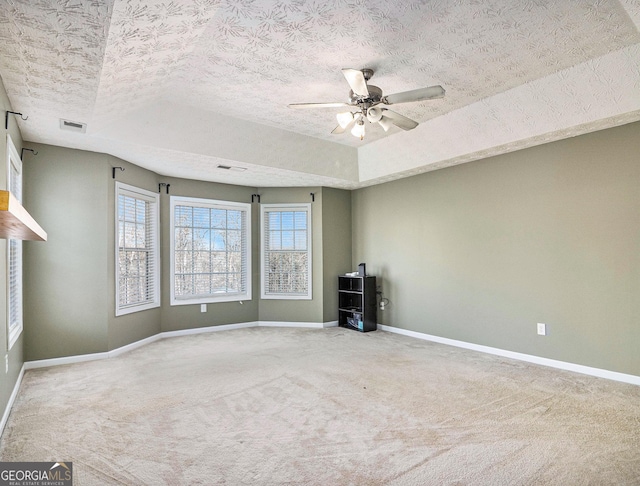 1301 Crosswind Pl, Mcdonough, GA 30252 - carpeted empty room with visible vents, baseboards, a textured ceiling, and ceiling fan