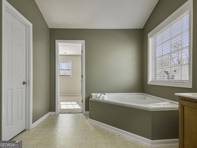 1301 Crosswind Pl, Mcdonough, GA 30252 - bathroom featuring a bath, tile patterned floors, vanity, and baseboards