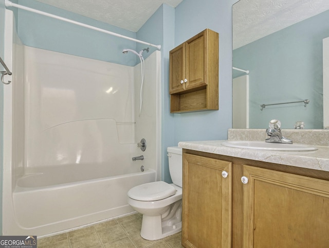 1301 Crosswind Pl, Mcdonough, GA 30252 - full bath with vanity, shower / washtub combination, tile patterned floors, a textured ceiling, and toilet
