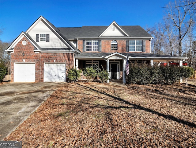 1301 Crosswind Pl, Mcdonough, GA 30252 - view of front of home with brick siding, covered porch, a garage, and driveway