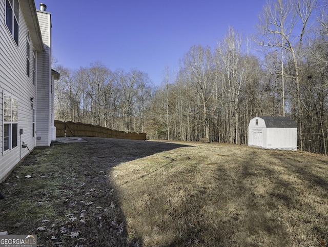 1301 Crosswind Pl, Mcdonough, GA 30252 - view of yard featuring a storage shed, an outdoor structure, and fence