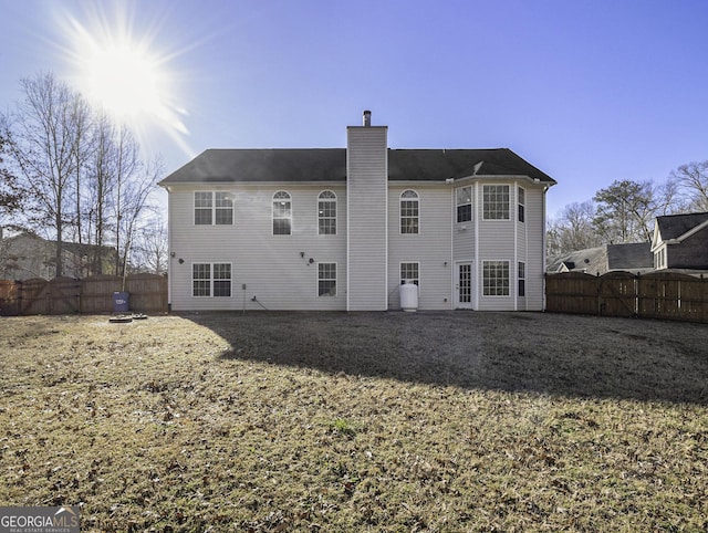 1301 Crosswind Pl, Mcdonough, GA 30252 - back of house featuring fence, a gate, and a chimney