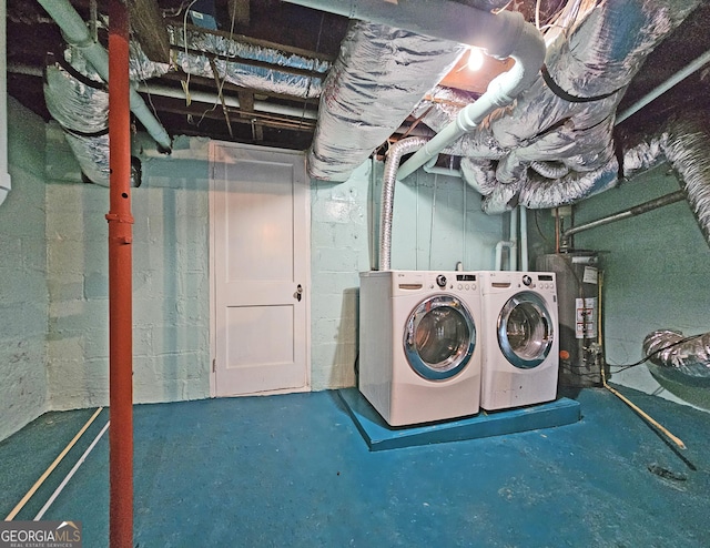 laundry area with washer and dryer and gas water heater