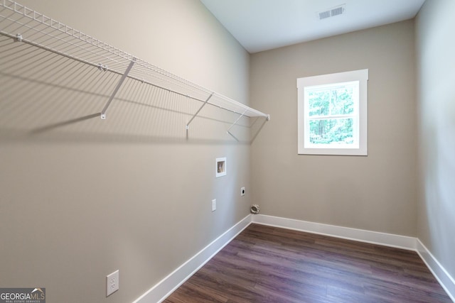 clothes washing area with hookup for an electric dryer, dark wood-type flooring, and washer hookup