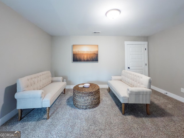 living area featuring carpet