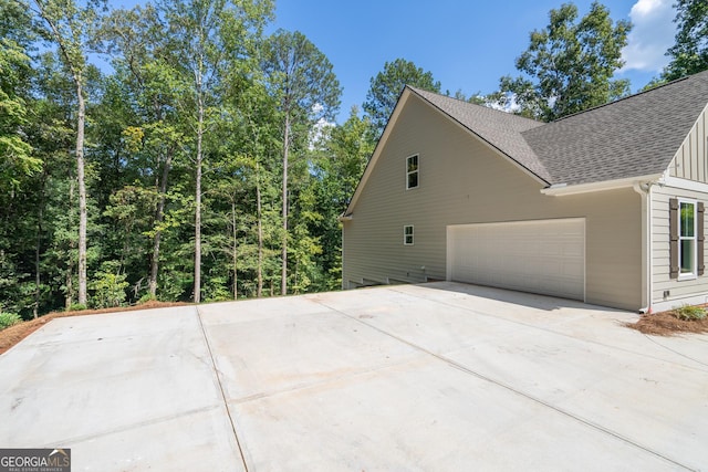 view of side of property featuring a garage