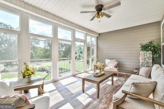 sunroom with a wealth of natural light and ceiling fan