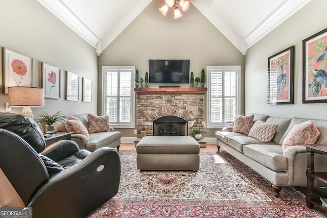 living room with a fireplace, high vaulted ceiling, hardwood / wood-style floors, and ornamental molding