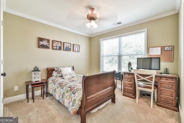 bedroom with ceiling fan, crown molding, and light carpet