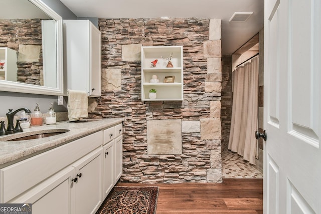 bathroom featuring wood-type flooring and vanity