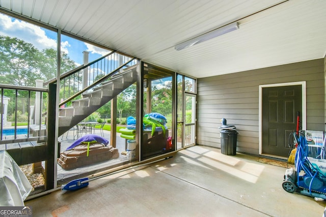 unfurnished sunroom with a wealth of natural light