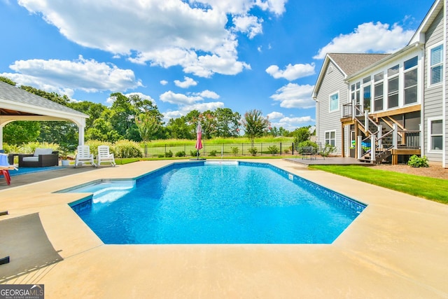 view of pool with an outdoor living space and a patio