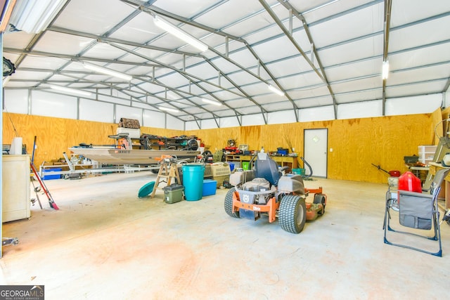 garage featuring wood walls