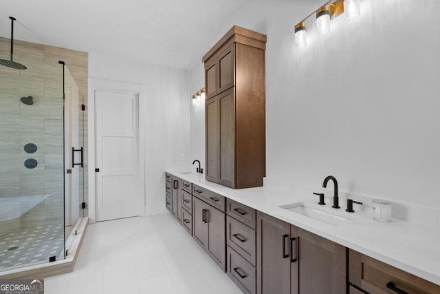 bathroom with vanity, tile patterned floors, and walk in shower