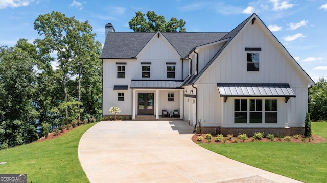 modern inspired farmhouse with a front yard