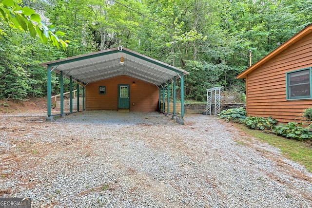 view of parking / parking lot featuring a carport