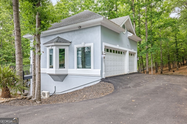 view of property exterior featuring a garage