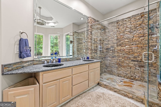 bathroom with vanity and an enclosed shower