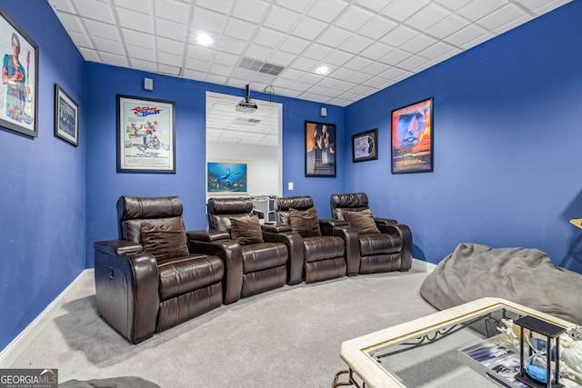 home theater room with carpet and a drop ceiling