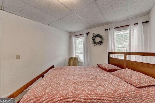 bedroom featuring a paneled ceiling