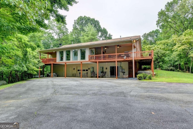 view of front of home with a deck and ceiling fan