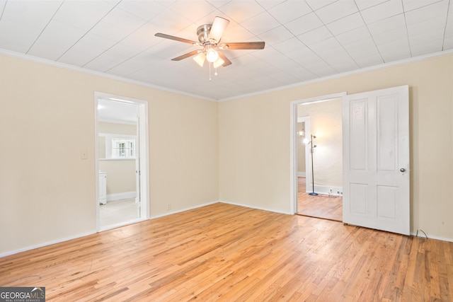 unfurnished room featuring ornamental molding, ceiling fan, and light wood-type flooring