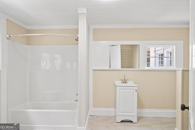 bathroom with tile patterned flooring, vanity, and  shower combination