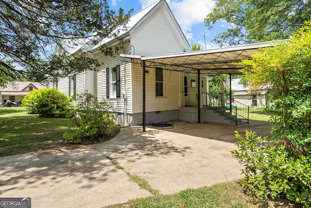 view of property exterior with a carport