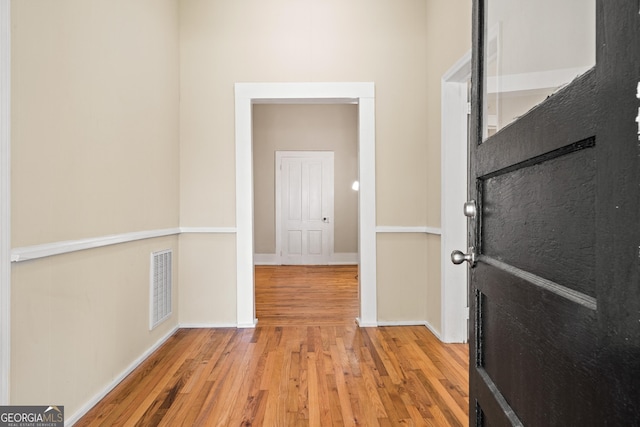 hall with light wood-type flooring