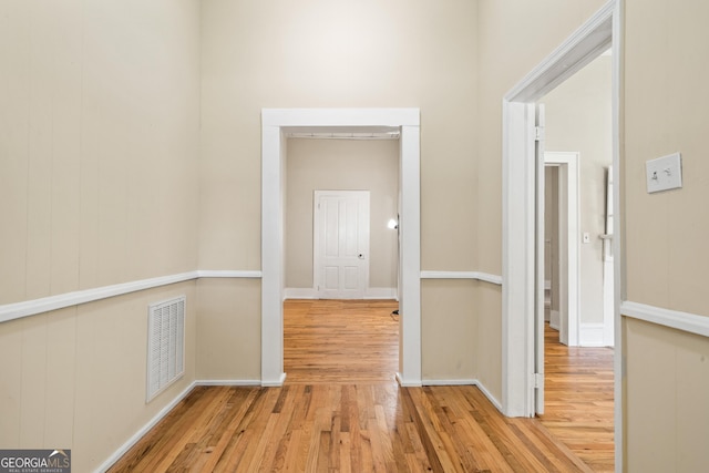 corridor with light wood-type flooring