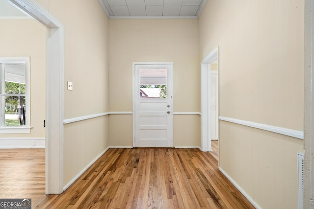 entryway with plenty of natural light and hardwood / wood-style floors