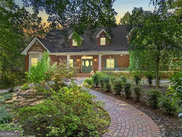 cape cod house with a porch