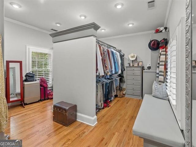 spacious closet featuring light hardwood / wood-style flooring