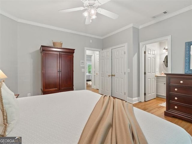 bedroom with ceiling fan, ornamental molding, a closet, ensuite bath, and light hardwood / wood-style floors