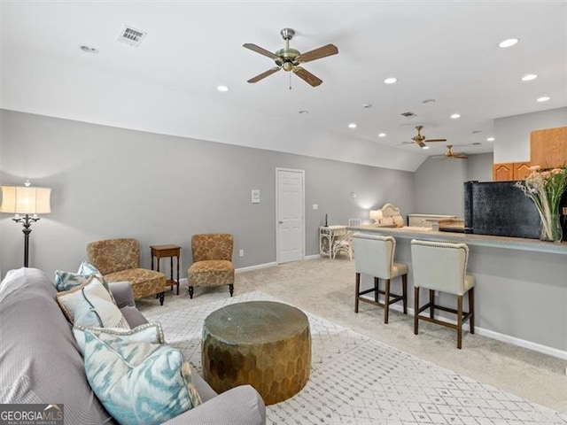 carpeted living room featuring ceiling fan