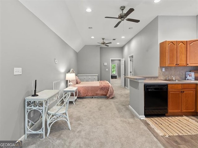 bedroom featuring sink, light carpet, and vaulted ceiling