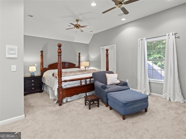 carpeted bedroom with ceiling fan and lofted ceiling