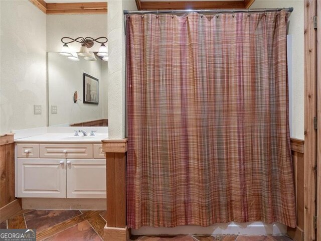 bathroom with tile patterned flooring and vanity