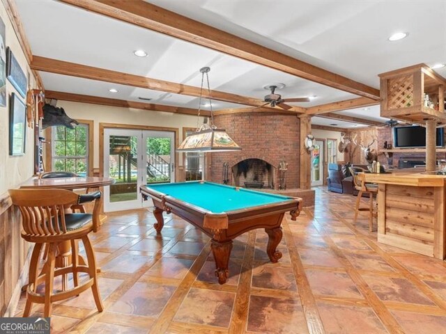 game room with ceiling fan, pool table, a brick fireplace, french doors, and light tile patterned flooring