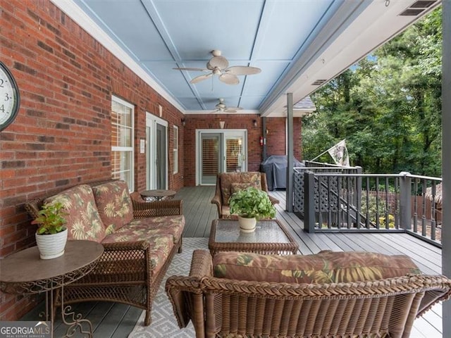 exterior space featuring ceiling fan and area for grilling