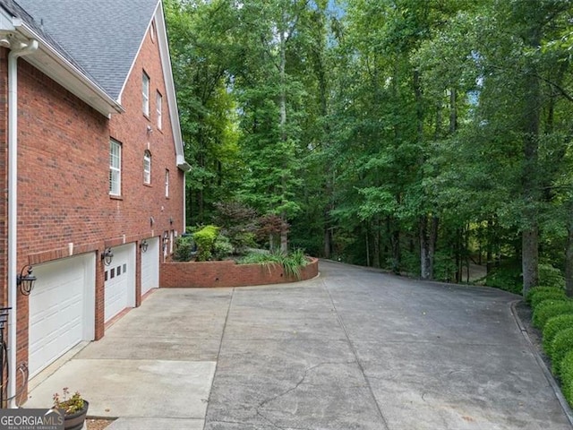 view of patio featuring a garage