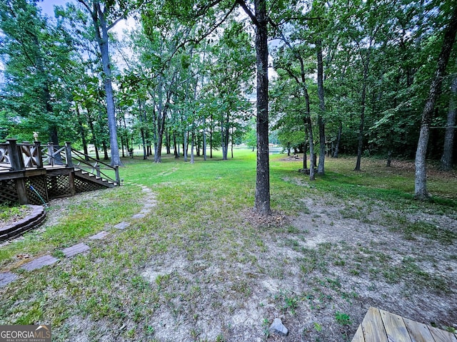 view of yard with a wooden deck