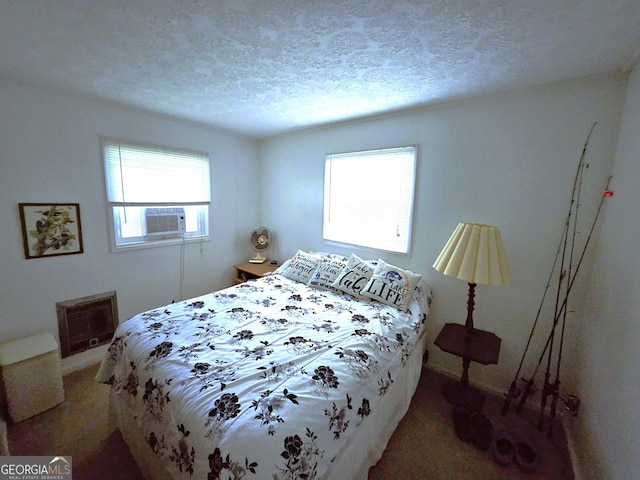 bedroom with carpet flooring, cooling unit, and a textured ceiling