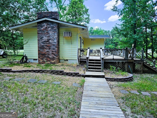 back of property with a deck