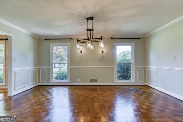 unfurnished dining area featuring a chandelier, a wealth of natural light, and a decorative wall