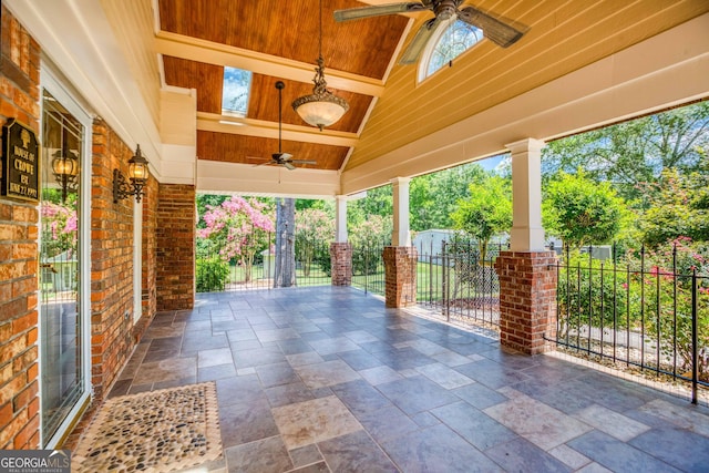 view of patio / terrace featuring fence and a ceiling fan