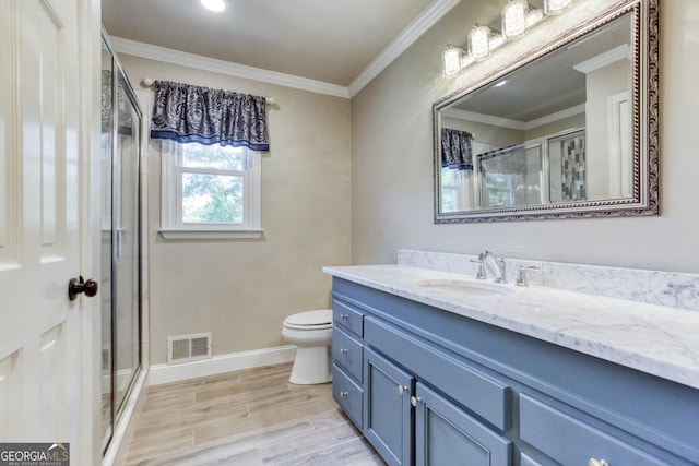 full bathroom featuring visible vents, crown molding, a stall shower, vanity, and toilet