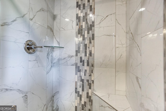 full bathroom featuring a marble finish shower