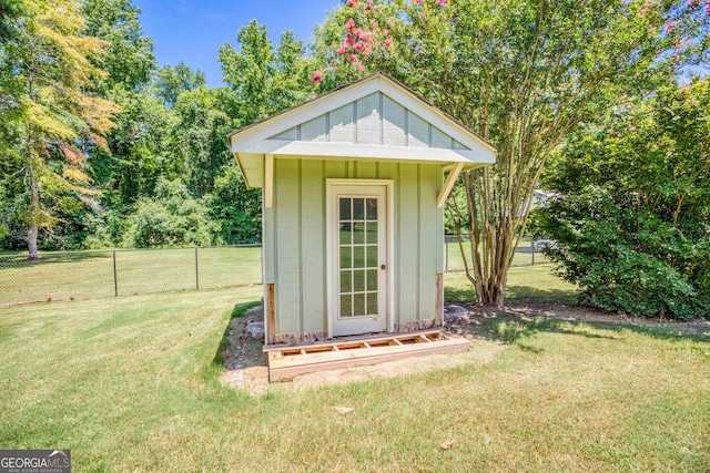 view of shed featuring fence